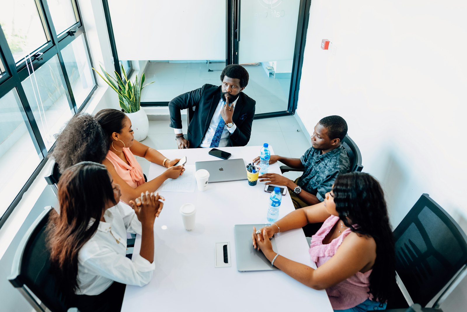 A team collaborating around a table, reviewing plans together